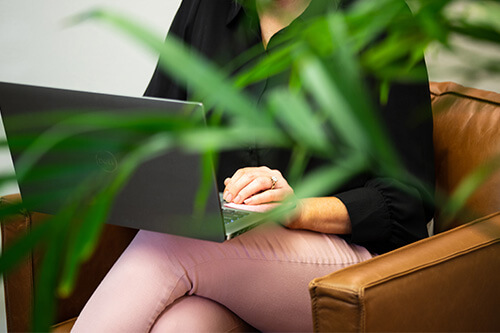 A psychologist typing on her computer. 