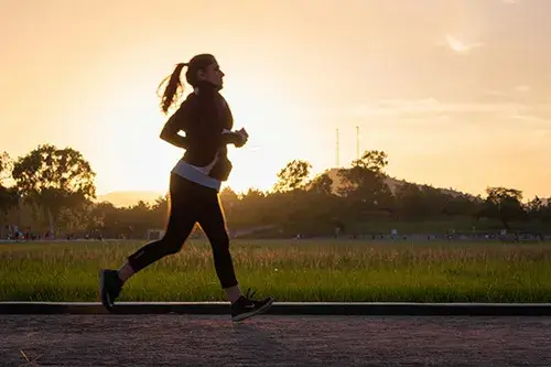 Exercising Regularly Woman jogging outside