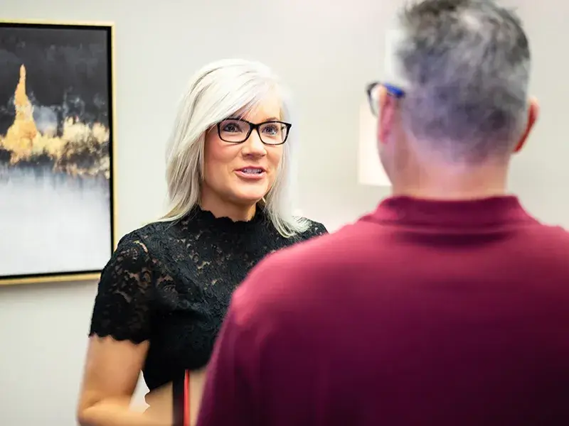 dr-whelan-discussion Dr. Whelan talking with another mental health professional