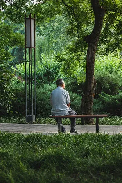 major-depression A man with major depressive disorder sitting on a bench