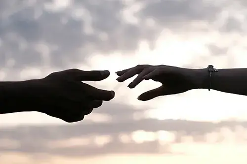 reaching-hands Two hands reaching for each other